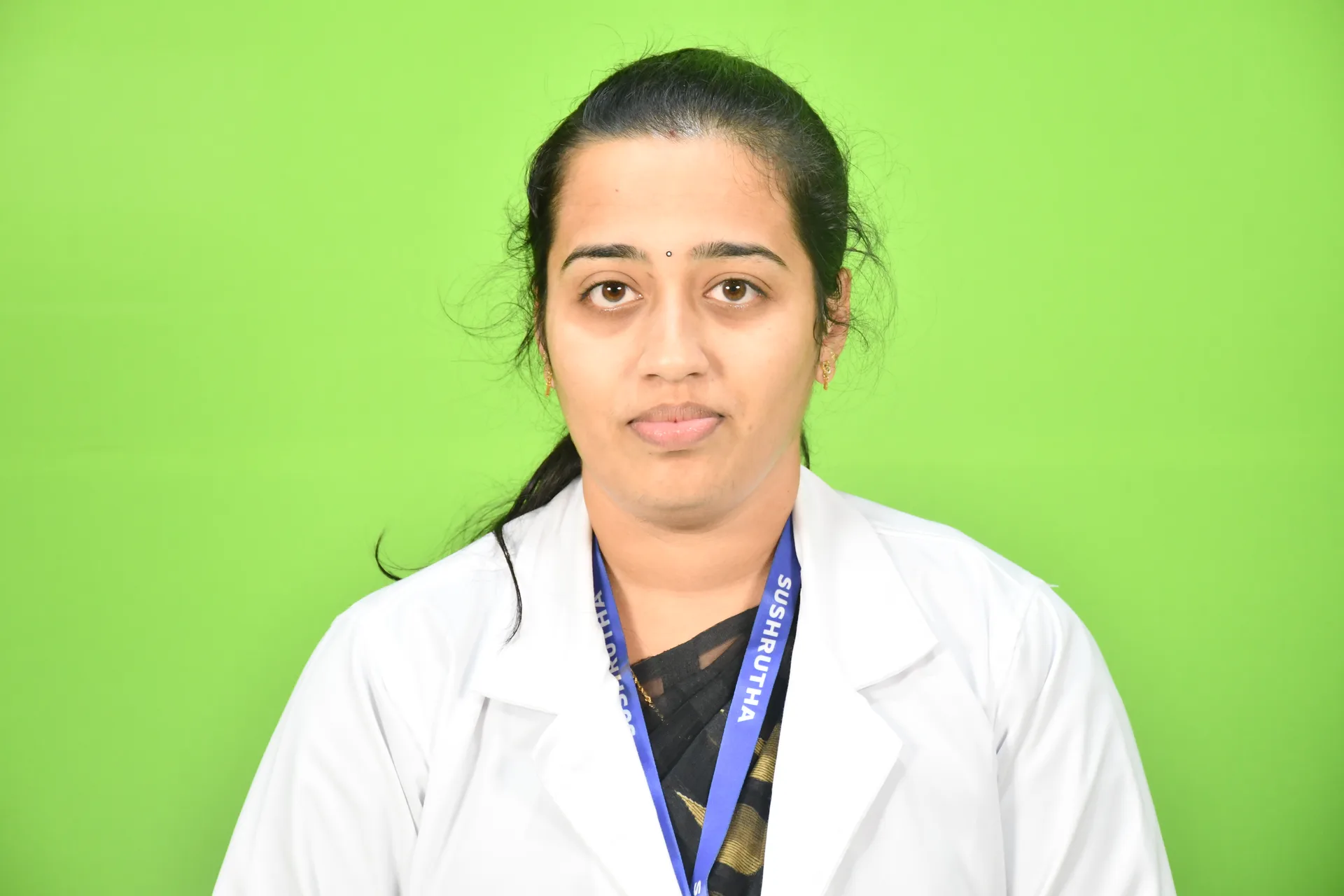 A portrait of a distinguished senior Ayurvedic physician in a white medical coat, standing in a sun-drenched herbal garden within the college campus.